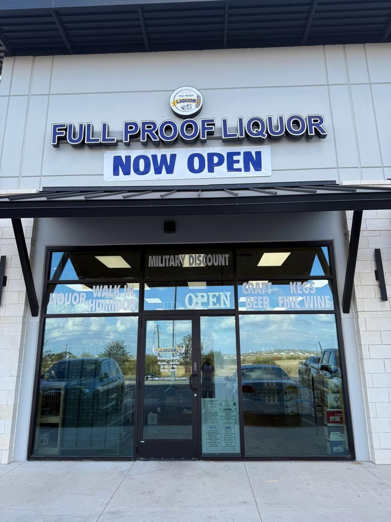 Full Proof Liquor storefront in San Antonio, TX with a Now Open banner under the illuminated sign