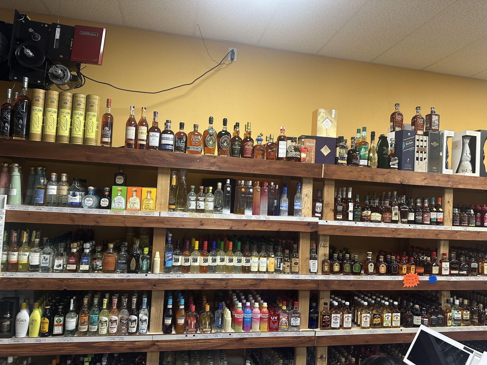 Full Proof Liquor store interior shelves in San Antonio stocked with whiskey, tequila and vodka