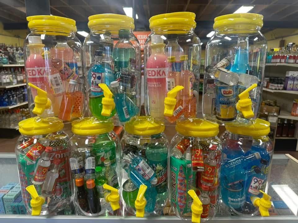 Wall of Full Proof Chug Jugs party cocktail kits at the San Antonio store
