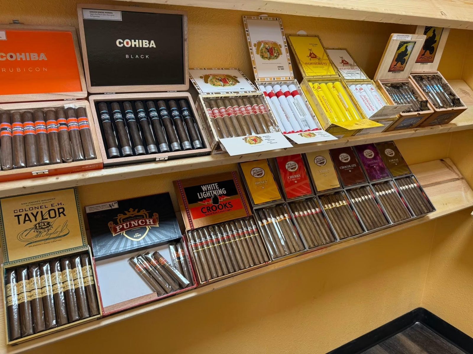 Walk-in humidor with premium cigars at Full Proof Liquor